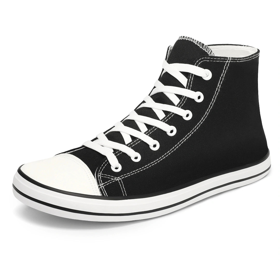 Zapatilla minimalista negra de lona estilo clásico, suela plana.
