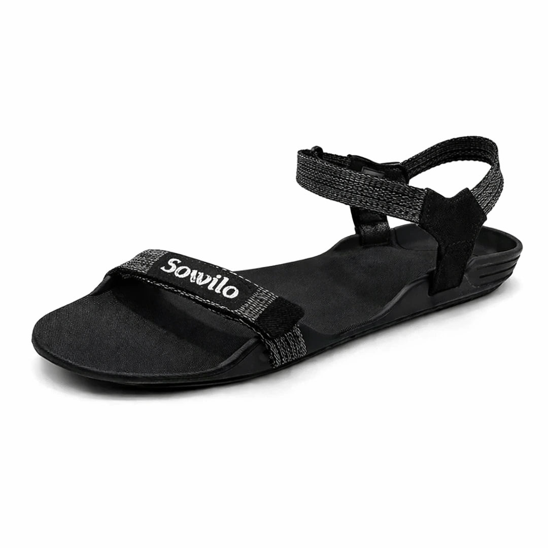 Sandalia barefoot Sowilo Raido negra vista lateral principal. 