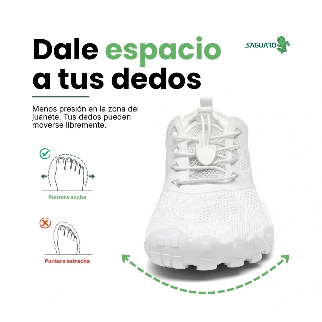 Zapatillas blancas vista frontal con puntera ancha barefoot.