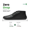 Vista lateral de zapatos barefoot formales negros con suela plana y diseño elegante.